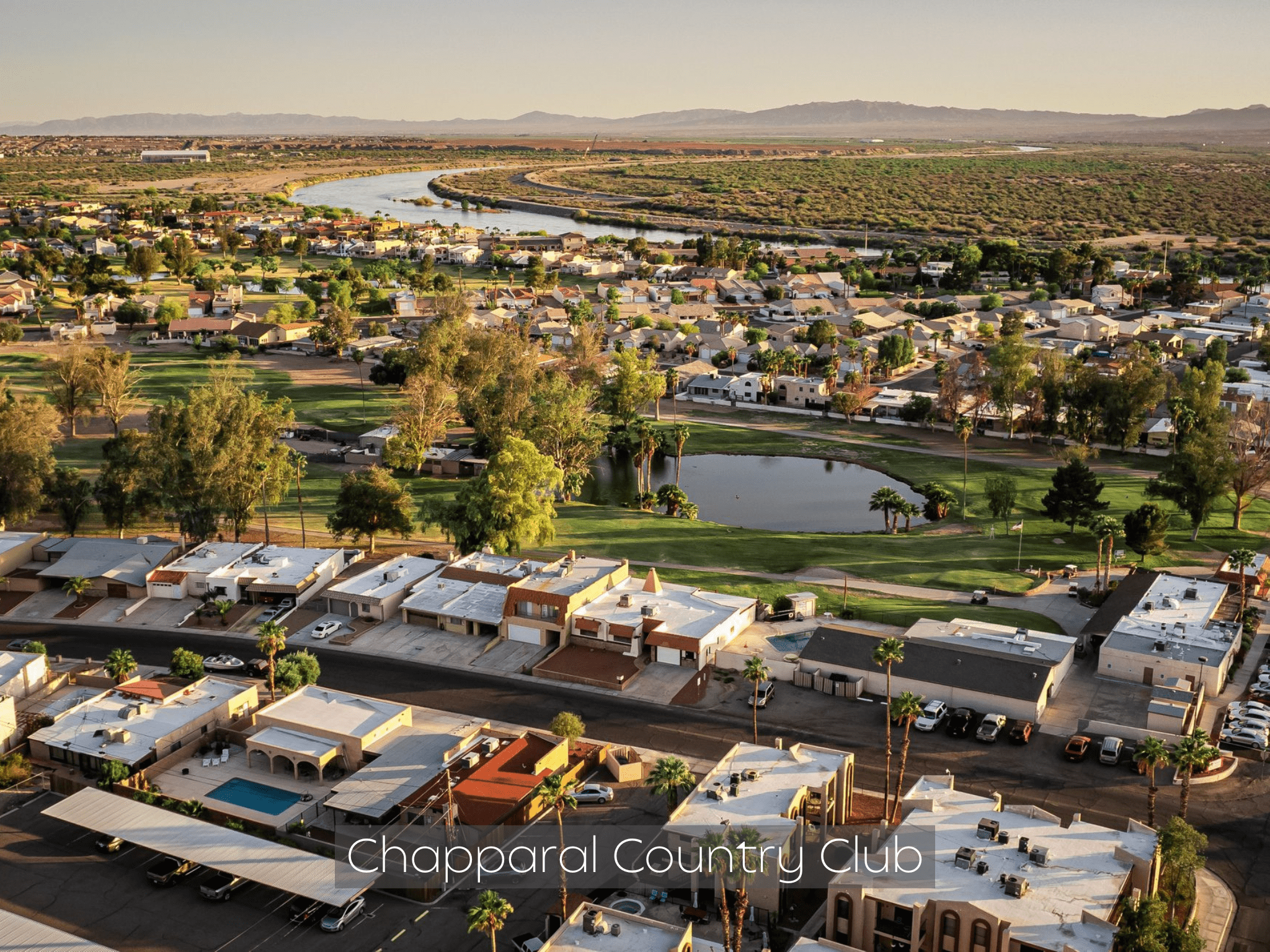 A scenic aerial view of Chaparral Country Club with a golf course and residential area.